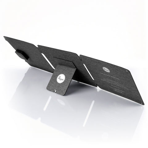 Black solar panel on a white background, fast charging solar panel, emergency charging for laptop and phone