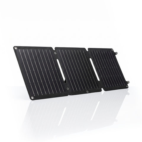 Black solar panel on a white background, fast charging solar panel, emergency charging for laptop and phone